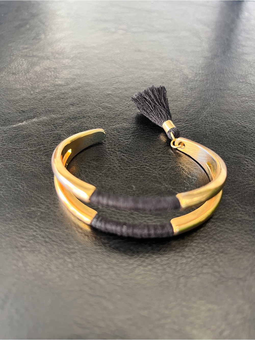 Vince Camuto Gold-Tone Open Cuff Bracelet with Black Thread and Tassel